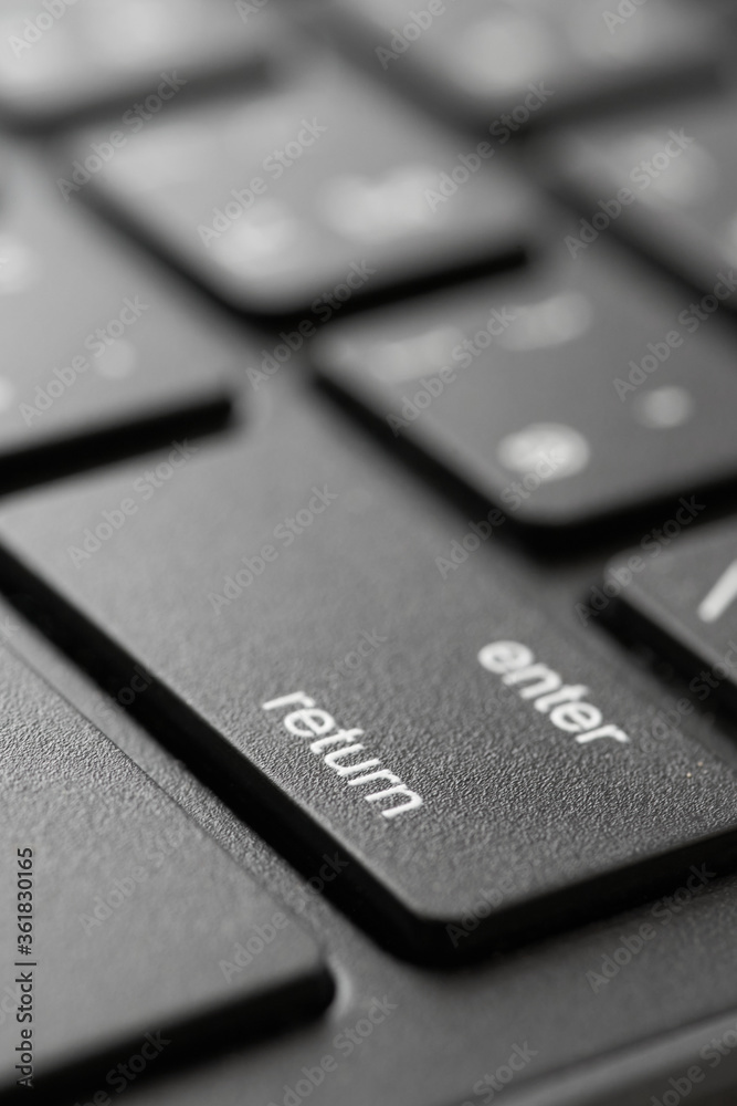 Close-up view of the Enter button on the computer keyboard Close-up view of the Enter button on the computer keyboard