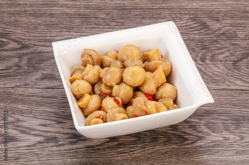 Pickled champignons in the bowl