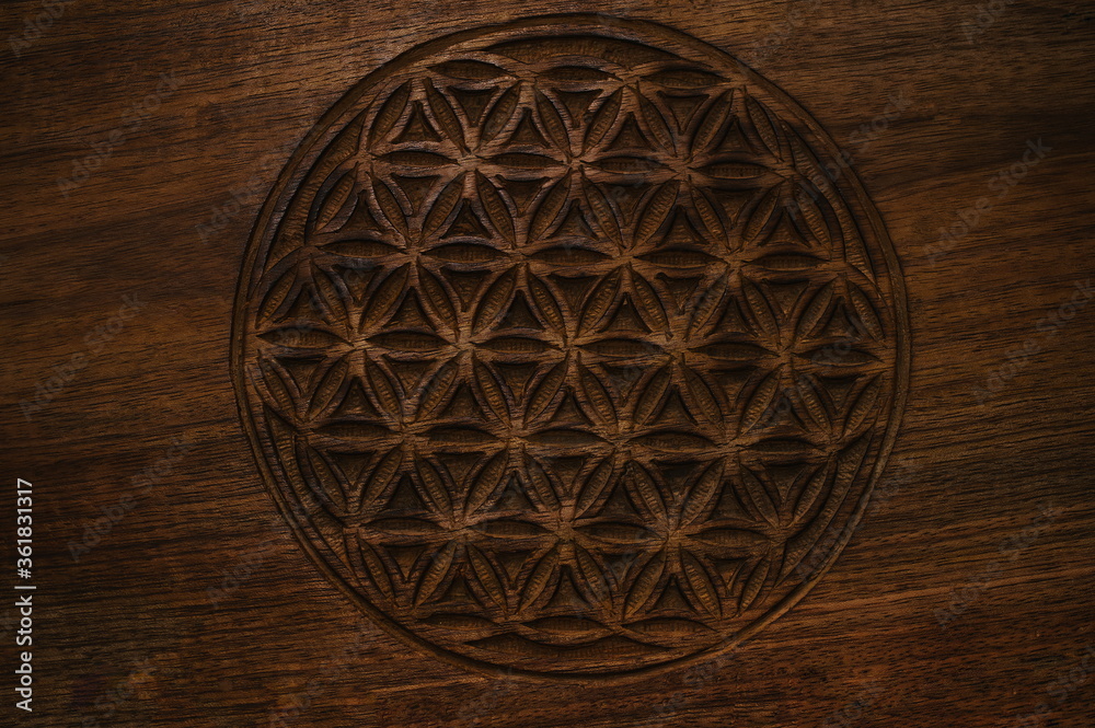 wooden flower of life sign texture background