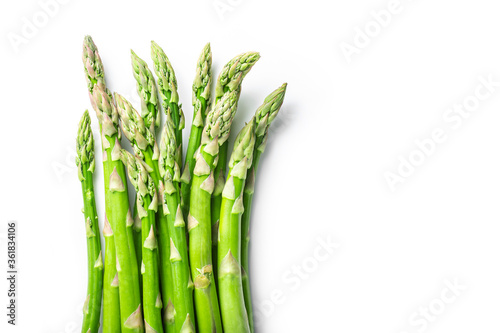 A bunch of asparagus on a white isolated background. Flat lay. The concept of proper nutrition.