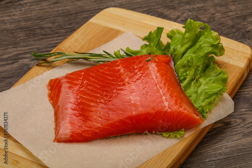 Salmon piece steak served rosemary