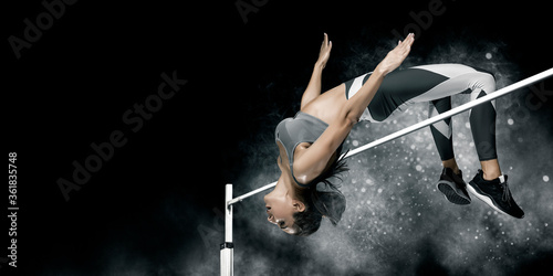 Woman in action of high jump. Sports banner photo