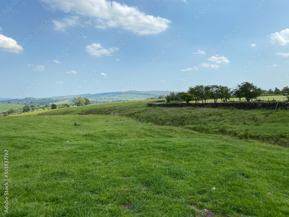 Landscape view, over fields, next to a small lane, leading to Embsay, Skipton, UK Landscape view, over fields, next to a small lane, leading to Embsay, Skipton, UK