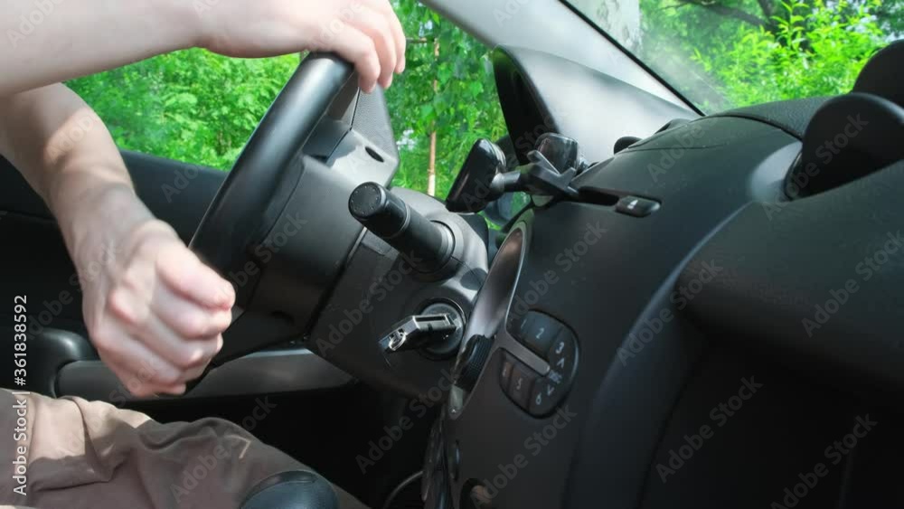 Man hand close-up making steering wheel rotation driving on turn. Close up Man hand close-up making steering wheel rotation driving on turn. Close up