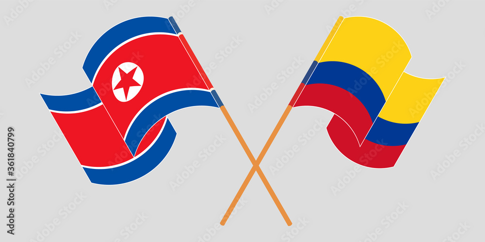 Crossed and waving flags of North Korea and Colombia