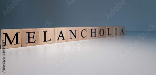 Text of melancholia from wooden cubes. psychological terms and health problems.
