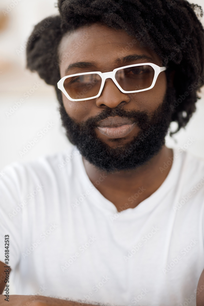 portrait of a handsome happy black man with wireless headphones portrait of a handsome happy black man with wireless headphones