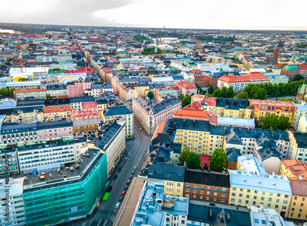 Naklejka premium Aerial sunset view of beautiful city Helsinki . Colorful sky and colorful buildings. Helsinki, Finland. 