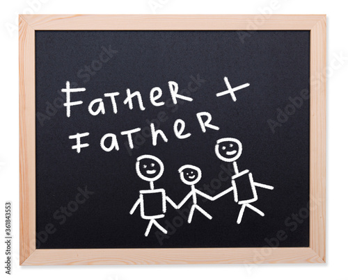 Gay family, two men and child drawn by chalk on black chalkboard, concept picture