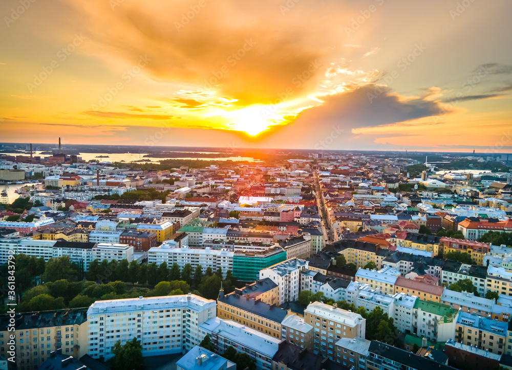 Aerial sunset view of beautiful city Helsinki . Colorful sky and colorful buildings. Helsinki, Finland.