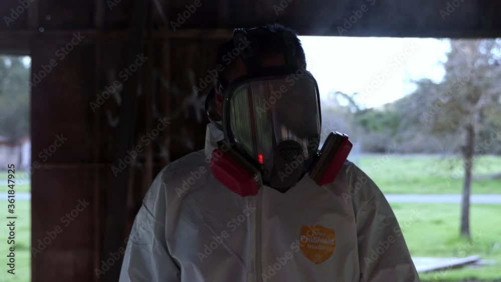 Hazmat suit walking through abandoned building Hazmat suit walking through abandoned building