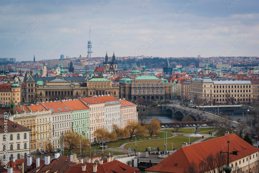 Panorama of Prague, Czech Republic. The view from above on the roofs of houses, the TV tower on the horizon.