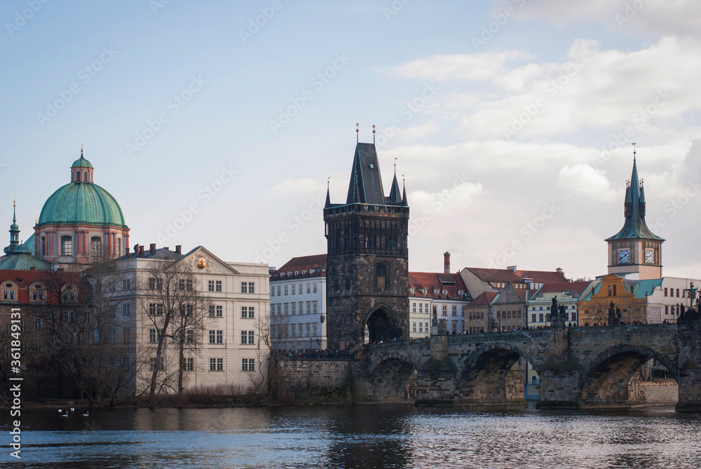 Panorama of the city of Prague, Czech Republic on a sunny day. View of Charles Bridge and the bank of the Vltava River.