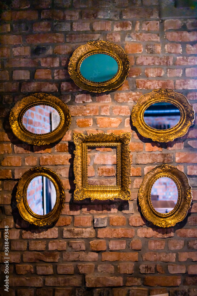 Empty vintage frames on the wall. Interior design. Copy space