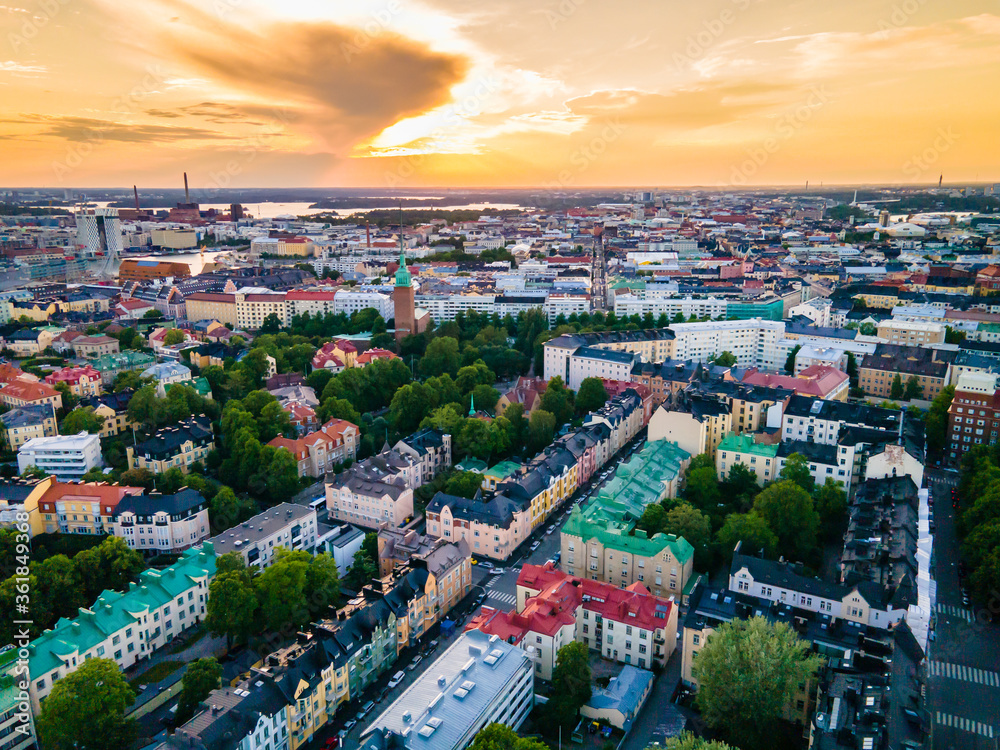 Aerial sunset view of beautiful city Helsinki . Colorful sky and colorful buildings. Helsinki, Finland.	