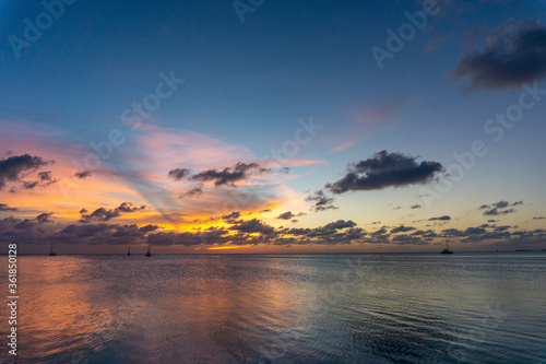 Dark Orange and blue sky over ocean sunset in Belize