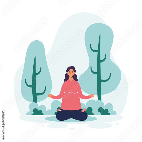 woman practicing yoga in the park