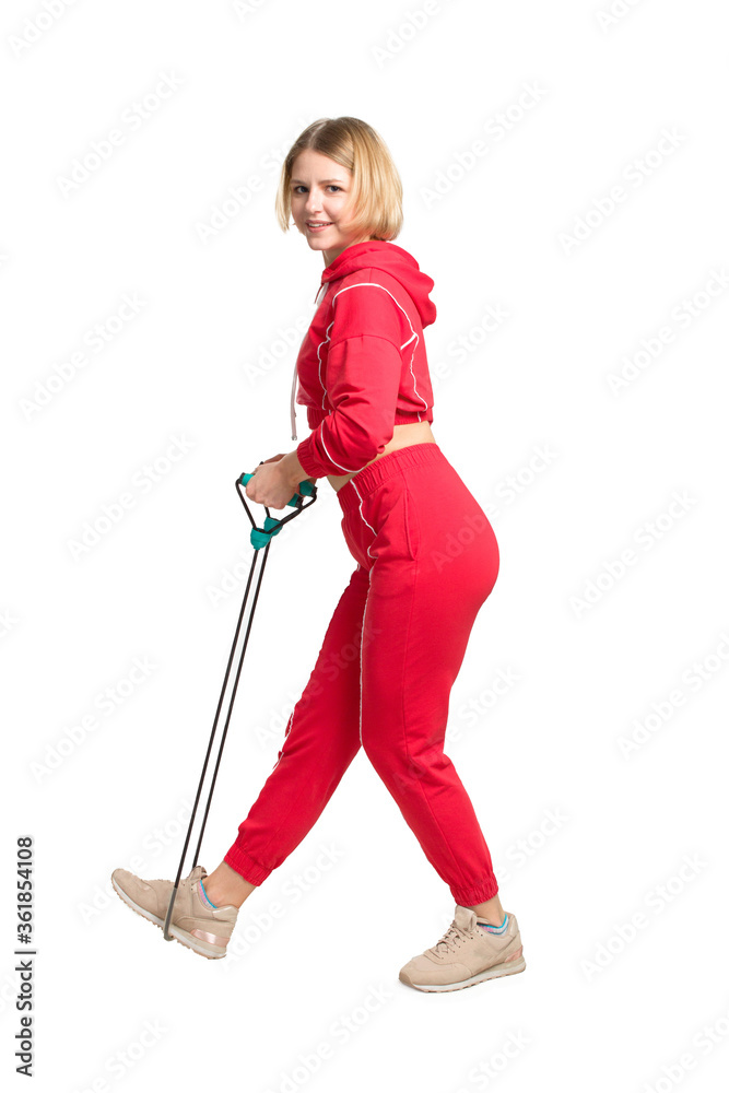 Young Fitness woman in red training dress. With a rope in his hands. Isolate on white background. Young Fitness woman in red training dress. With a rope in his hands. Isolate on white background.