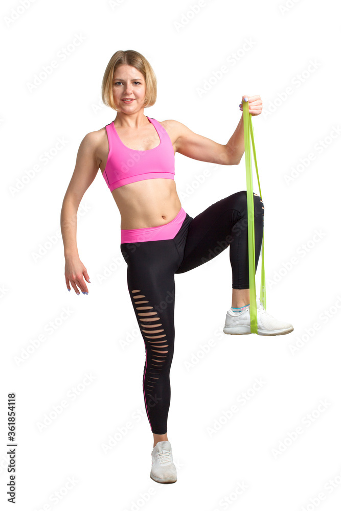 Young Fitness woman in training dress. with green rubber band. Isolate . Young Fitness woman in training dress. with green rubber band. Isolate .