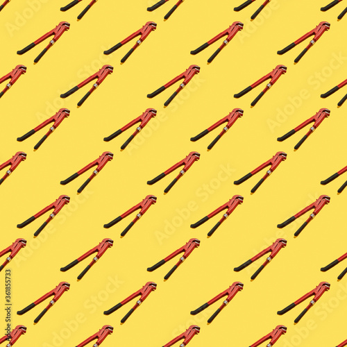 Wallpaper Mural A monkey wrench seamless pattern on the yellow background. background backdrop. texture for design. Torontodigital.ca
