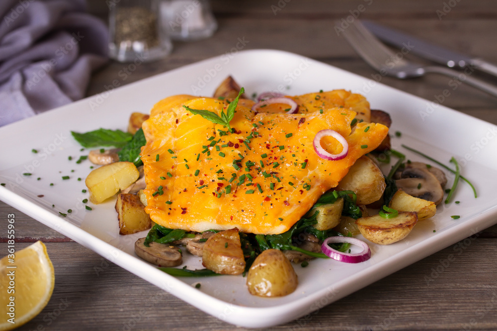 Smoked cod fish fillets with potatoes, mushrooms and spinach Smoked cod fish fillets with potatoes, mushrooms and spinach