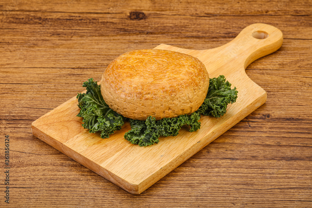 Smoked Georgian suluguni cheese piece Smoked Georgian suluguni cheese piece