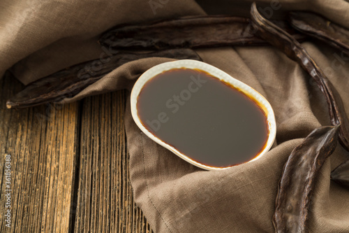 Traditional Harnup molasses  on the wooden background.