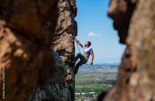 фотографія A rock climber on a rock