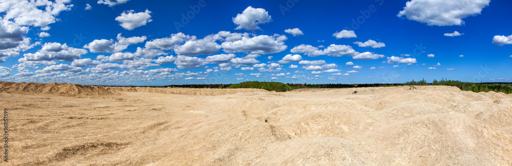 The hill-like stone ridge of the Bornitsky quarry. The village of New Khinkolovo, Gatchinsky district, Leningrad region. Russia