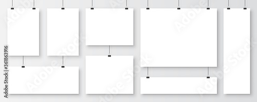 Realistic blank paper sheets hanging on binder clip. White vector poster with shadow in A4 format. Design template, mockup.