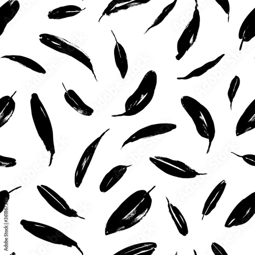 Brush black long leaves vector seamless pattern. Silhouettes of banana leaves, eucalyptus foliage. © Анастасия Гевко