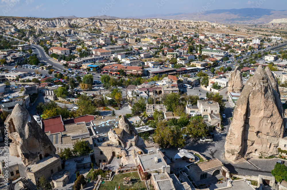 View of Goreme town in Nevsehir Province, Central Anatolia located among amazing fairy chimney rock formations in Cappadocia region of Turkey