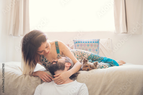 Couple in love laughing in their room
