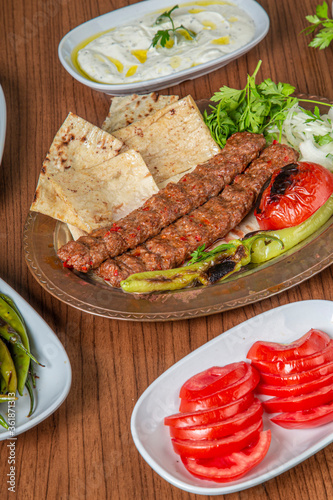 Turkish Adana Kebab Dinner on wooden background.