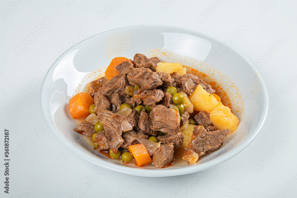 Turkish Tas Kebab Dinner on wooden background. Turkish Tas Kebab Dinner on wooden background.