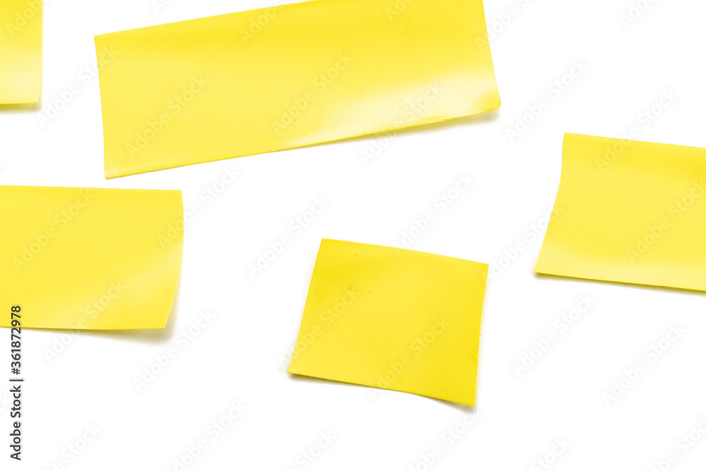 Sticky scotch duct paper. Piece of yellow adhesive torn grunge tape isolated on white background. Strip texture. Sticky scotch duct paper. Piece of yellow adhesive torn grunge tape isolated on white background. Strip texture.