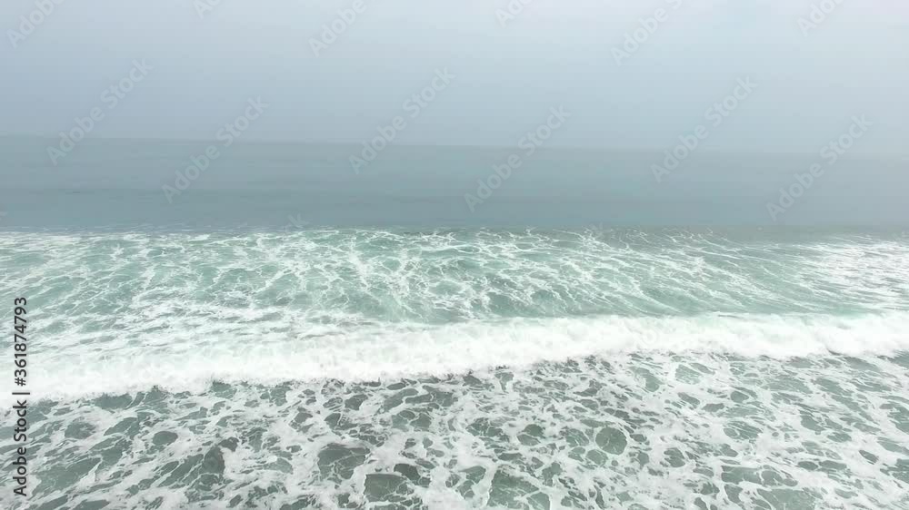 Beautiful aerial view of the beach with black sand of tropical jungle Beautiful aerial view of the beach with black sand of tropical jungle