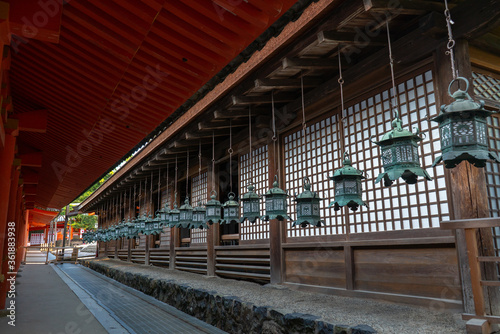 Buddhist temple green lanterns row at Kasuga-Taisha Shrine in Nara Japan