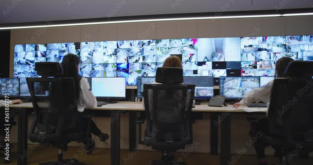 Security control room operator at work, Security System Operator Looking At Cctv Footage