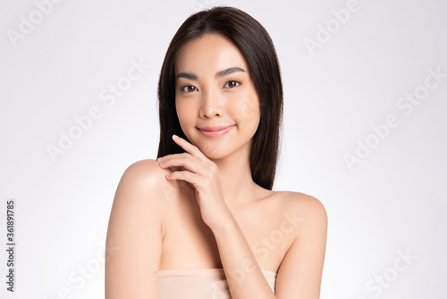 Beautiful Young asian Woman touching her clean face with fresh Healthy Skin, isolated on white background, Beauty Cosmetics and Facial treatment Concept