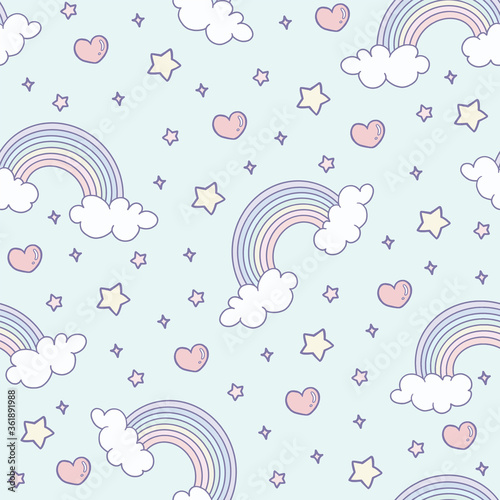 Cute rainbow with clouds and hearts on a light blue background seamless patter. photo