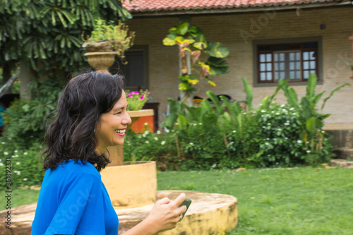 Happy middle-aged brunette woman outdoors