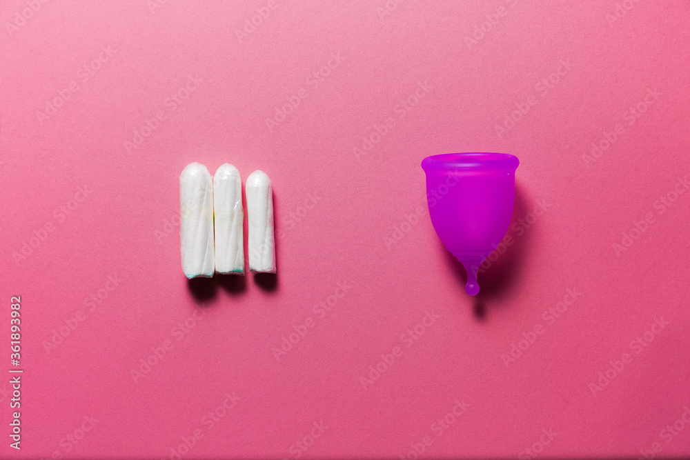 Feminine hygiene products on bright pink background Feminine hygiene products on bright pink background