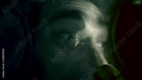 Wallpaper Mural a man's head with frightened rotating eyes stuck in a container with flies. 
nasty flying flies, dark horror lighting, horror, thriller, mysticism in slow motion. Torontodigital.ca