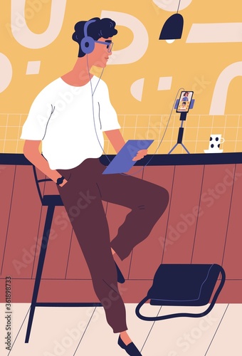 Modern guy in headphones use smartphone during live streaming vector flat illustration. Male blogger broadcasting at social media networks. Man speaker communicating with followers at studio