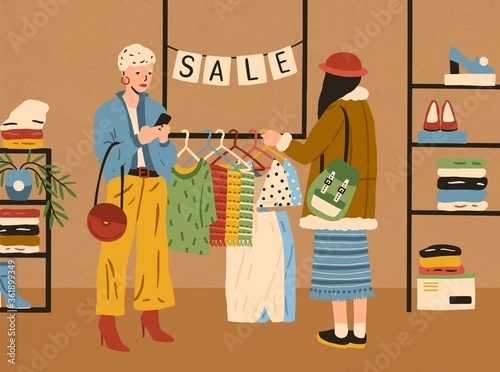 Two modern fashion female use smartphone and choosing clothes in boutique vector flat illustration. Woman customer looking at colorful apparel on hanger. Stylish girl enjoying shopping during sale