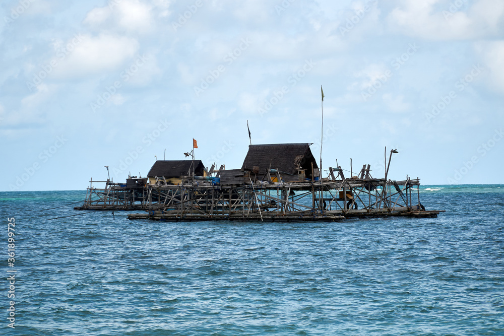 Boats and wooden fisherman house at the sea Boats and wooden fisherman house at the sea