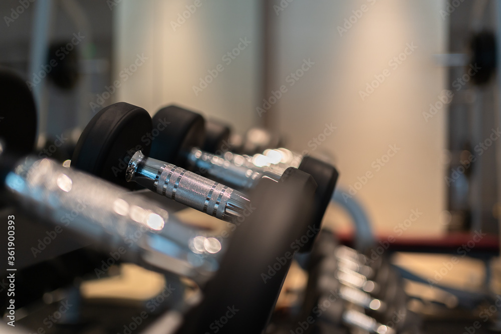 Naklejka premium dumbbell on a wooden table