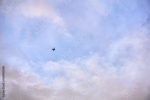 Silhouette of airplane flying in the sky