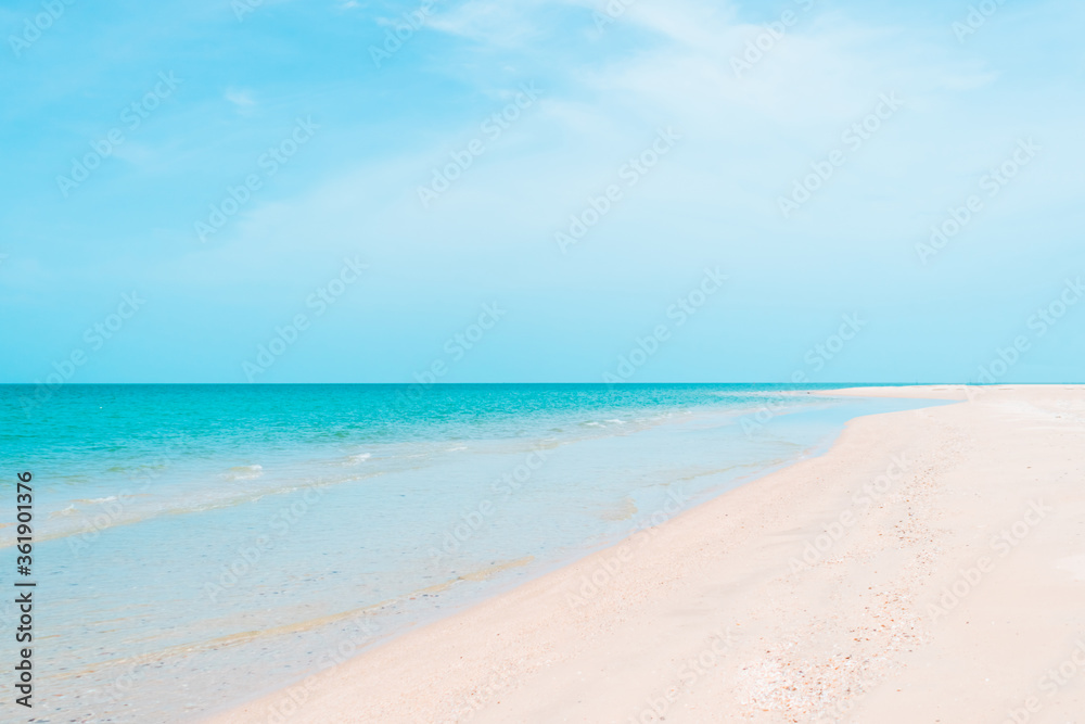 Tropical nature clean beach and white sand in summer with sun light blue sky and bokeh background.